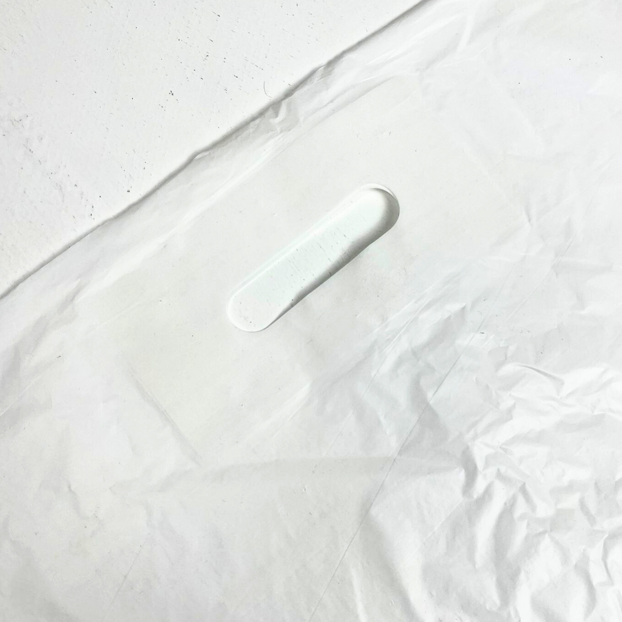 22" x 18" Strong White Patch Handle Plastic Carrier Bag with reinforced handles, available in packs of 100 or boxes of 500.