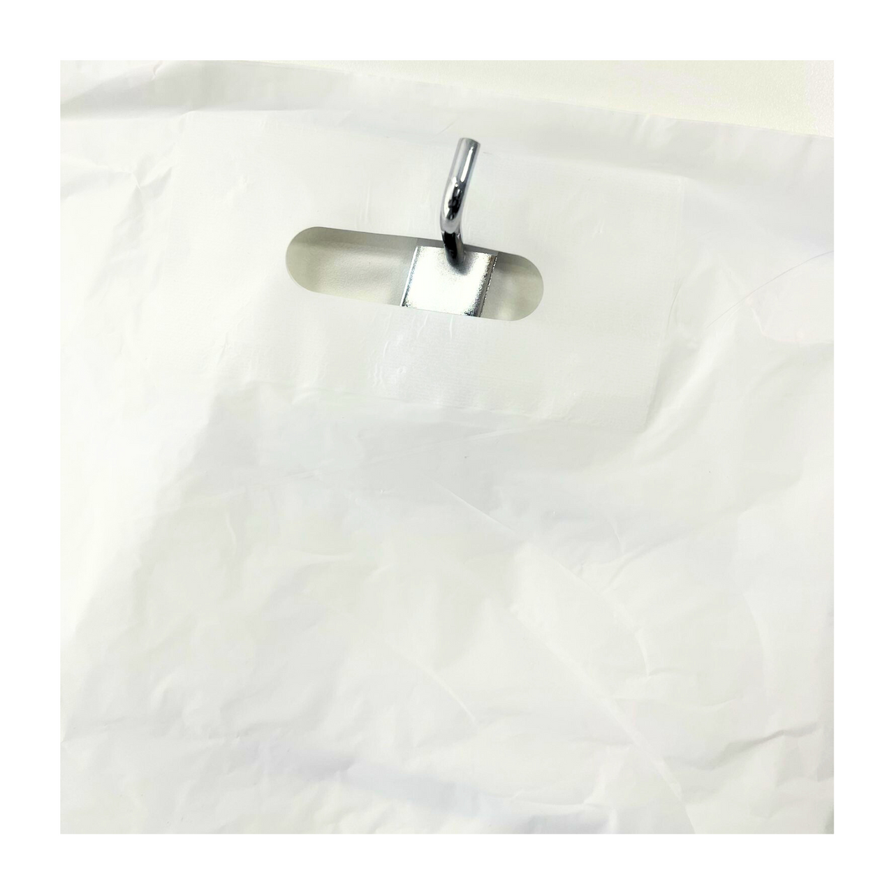 Our 15" x 18" Strong White Patch Handle Plastic Carrier Bag combines durability and elegance, with reinforced handles for easy carrying. Perfect for any retail setting, it ensures a secure and stylish transport of your products.